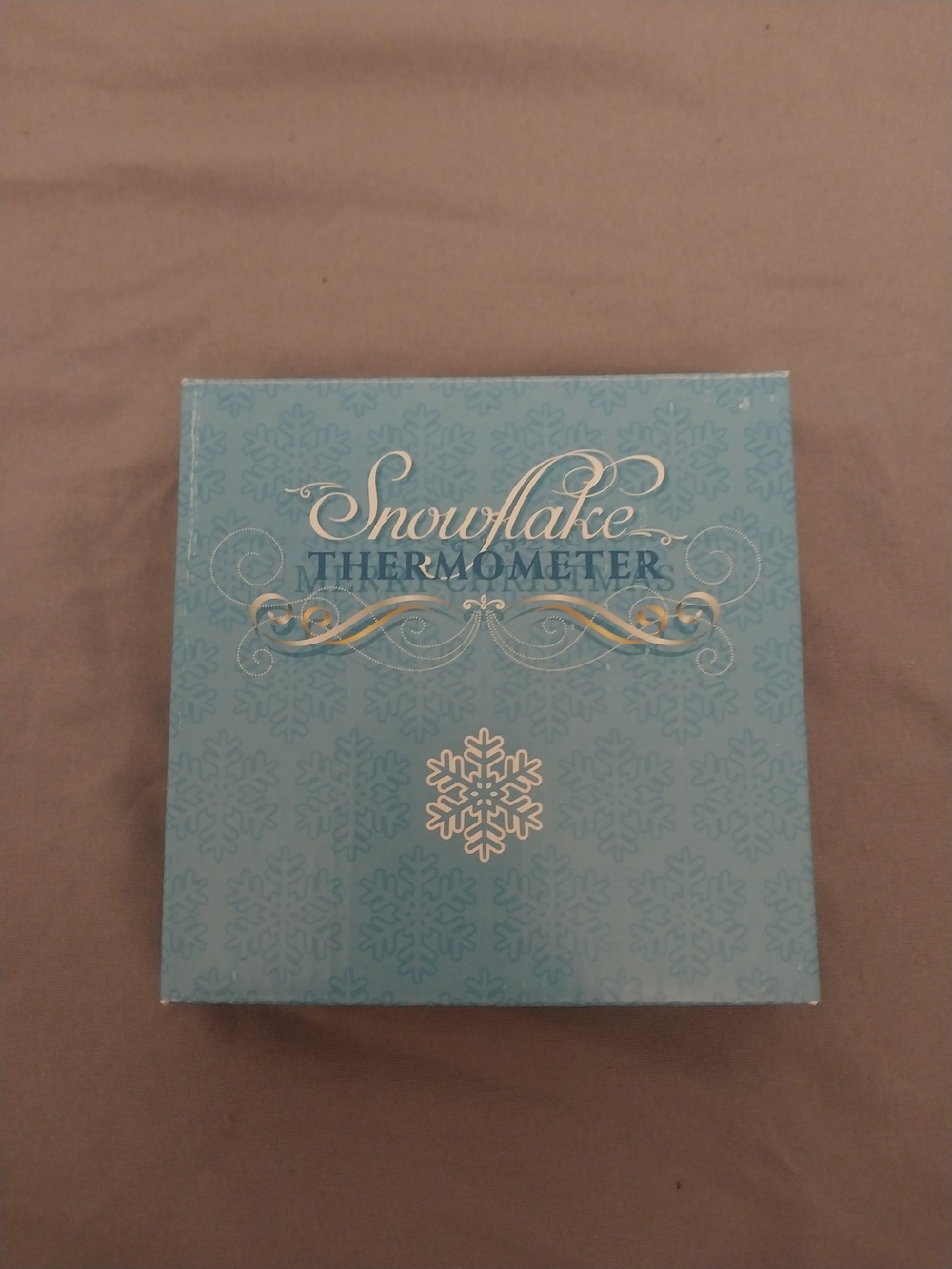 Snowflake decorative thermometer.